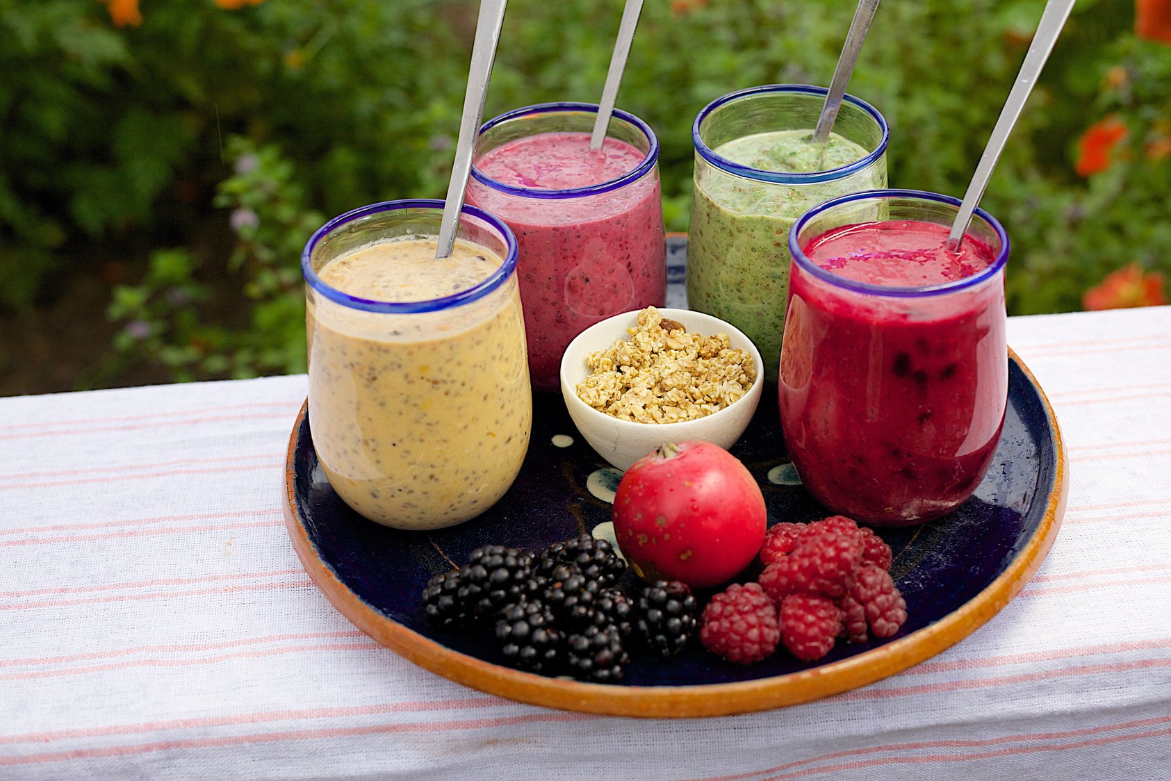 Image of four health smoothies on a serving tray